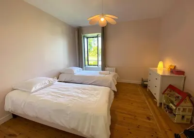 Un ou plusieurs lits dans un hébergement de l'établissement Villa Locquenole Sea View