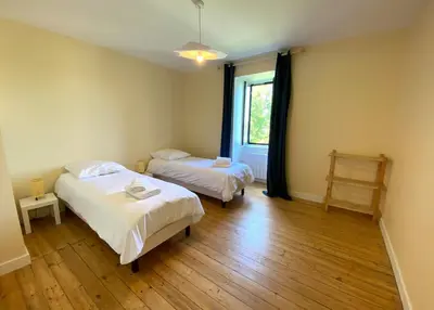 Un ou plusieurs lits dans un hébergement de l'établissement Villa Locquenole Sea View