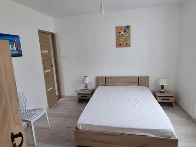 Un ou plusieurs lits dans un hébergement de l'établissement Maison vue mer, 2 chambres au Conquet