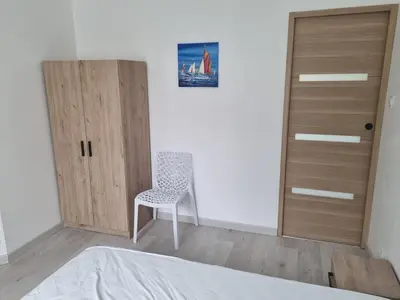 Un ou plusieurs lits dans un hébergement de l'établissement Maison vue mer, 2 chambres au Conquet