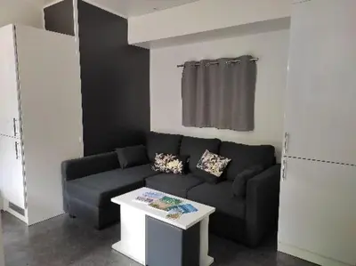 Coin salon dans l'établissement Mobil home TAOS Luxe H20 - Camping de Lanniron