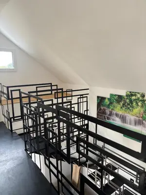 Un ou plusieurs lits dans un hébergement de l'établissement Gîte des capucines