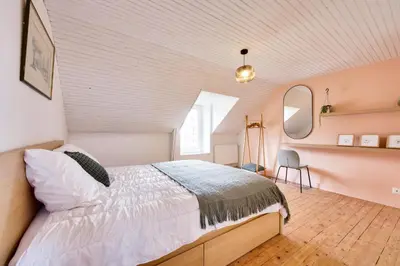 Un ou plusieurs lits dans un hébergement de l'établissement Vue mer - Maison pour 8 avec jardin et terrasse