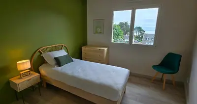 Un ou plusieurs lits dans un hébergement de l'établissement Maison vue mer Posto Home Crozon