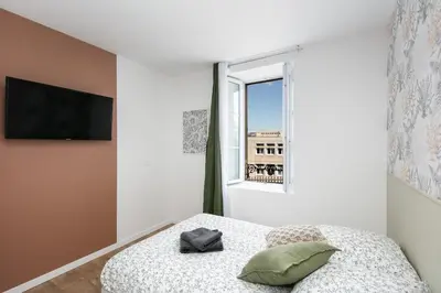 Un ou plusieurs lits dans un hébergement de l'établissement Chambre indépendante Clapot