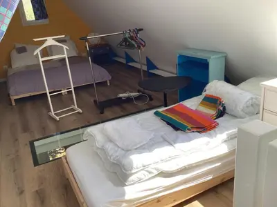 Un ou plusieurs lits dans un hébergement de l'établissement Chez Éliane au bord de la mer