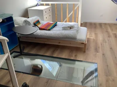 Un ou plusieurs lits dans un hébergement de l'établissement Chez Éliane au bord de la mer