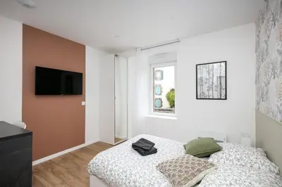 Un ou plusieurs lits dans un hébergement de l'établissement Chambre indépendante Pétole