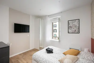 Un ou plusieurs lits dans un hébergement de l'établissement Chambre indépendante Trinquette
