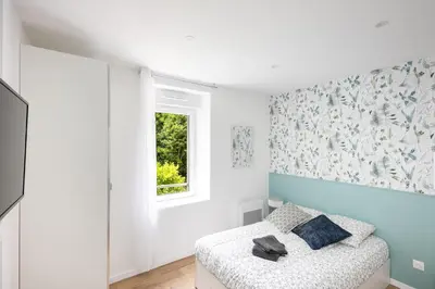 Un ou plusieurs lits dans un hébergement de l'établissement Chambre indépendante Cormoran