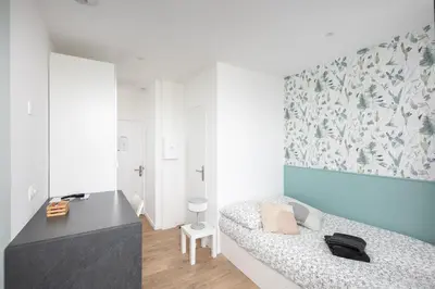 Un ou plusieurs lits dans un hébergement de l'établissement Chambre indépendante Mouette