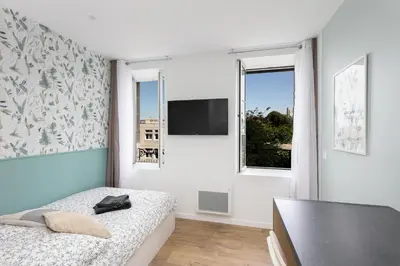 Télévision ou salle de divertissement dans l'établissement Chambre indépendante Mouette