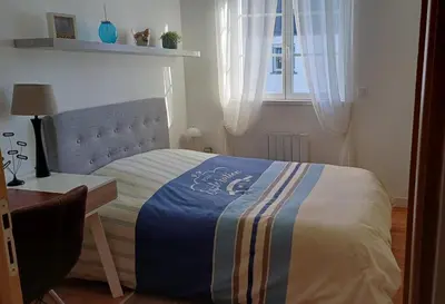 Un ou plusieurs lits dans un hébergement de l'établissement Chambre cosy