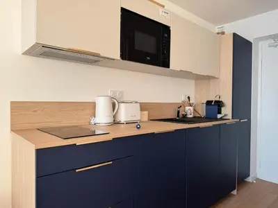 Cuisine ou kitchenette dans l'établissement Flots Bleus - Cozy Studio - White Sand Beach