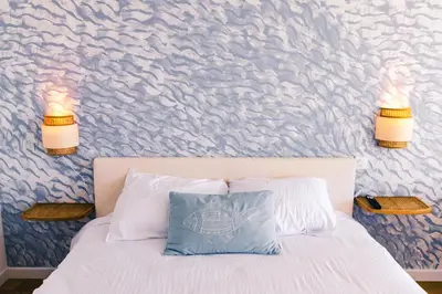 Un ou plusieurs lits dans un hébergement de l'établissement Reve Bleu - Studio face a la mer avec balcon - Concarneau plage