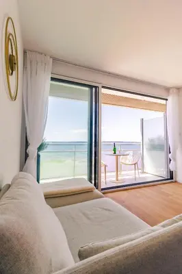 Un ou plusieurs lits dans un hébergement de l'établissement Reve Bleu - Studio face a la mer avec balcon - Concarneau plage