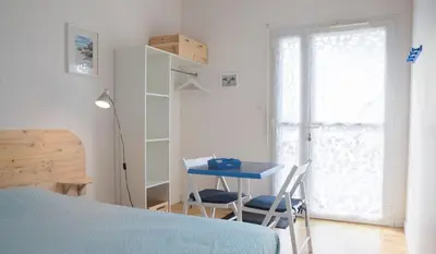 Un ou plusieurs lits dans un hébergement de l'établissement Le Pénity, studio lumineux à Carnoët
