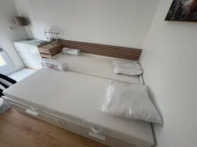 Un ou plusieurs lits dans un hébergement de l'établissement Maison 2chambres dressing bureau jardin clos pour 4 Personnes