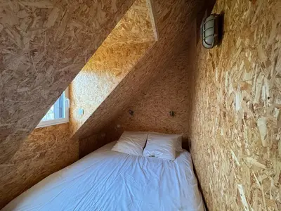 Un ou plusieurs lits dans un hébergement de l'établissement Maison atypique, au coeur de Sainte Marine