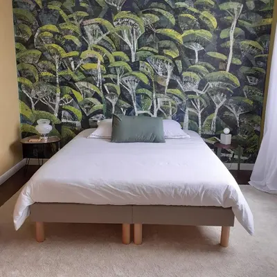 Un ou plusieurs lits dans un hébergement de l'établissement Les Chambres de Kérity