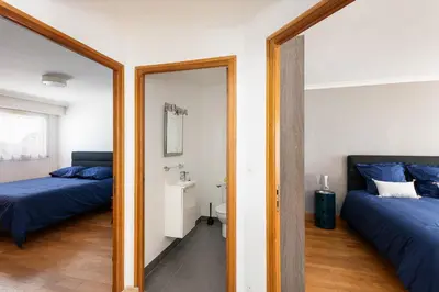 Un ou plusieurs lits dans un hébergement de l'établissement Appart de standing au centre-ville avec Vue Mer Terrasse et Garage