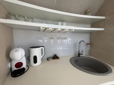 Cuisine ou kitchenette dans l'établissement ANTHENEA Trebeurden