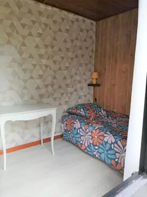 Un ou plusieurs lits dans un hébergement de l'établissement Maison vue sur mer