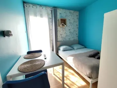 Un ou plusieurs lits dans un hébergement de l'établissement Beau studio en toute intimité proche facultés