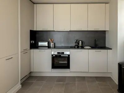 Cuisine ou kitchenette dans l'établissement PORS-MABO T3 piscine et vue mer