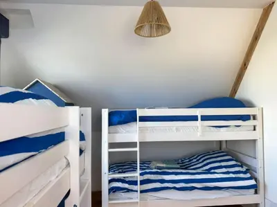 Un ou plusieurs lits dans un hébergement de l'établissement Villa Kermilon sea view and quiet 12p