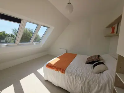 Un ou plusieurs lits dans un hébergement de l'établissement charmante maison a 300 m de la plage et du GR 34