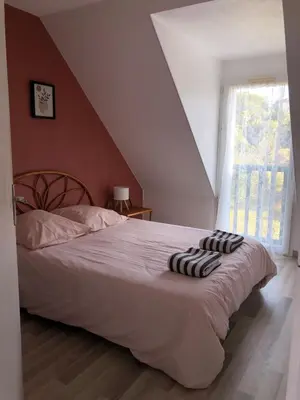 Un ou plusieurs lits dans un hébergement de l'établissement Cap Cozy Maison près de la mer fouesnant