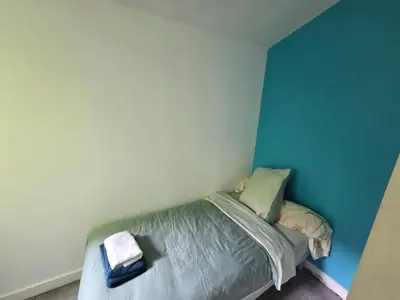 Un ou plusieurs lits dans un hébergement de l'établissement Appartement confortable à Brest, 40 m² avec 2 chambres