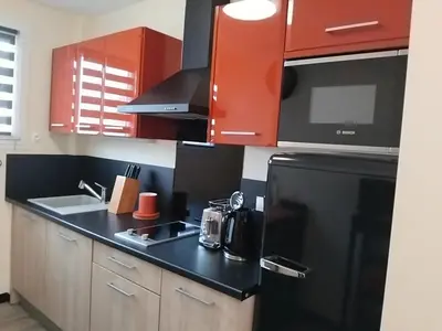 Cuisine ou kitchenette dans l'établissement A 2 pas des iles