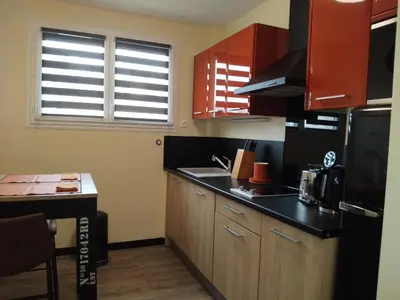 Cuisine ou kitchenette dans l'établissement A 2 pas des iles