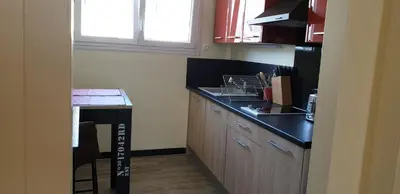 Cuisine ou kitchenette dans l'établissement A 2 pas des iles