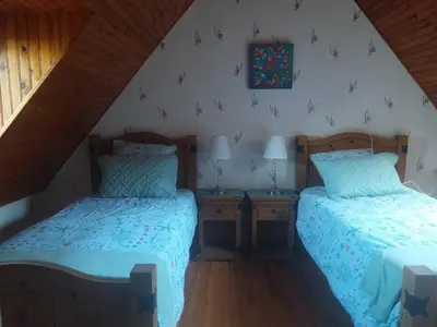 Un ou plusieurs lits dans un hébergement de l'établissement Maison de pêcheur vue mer