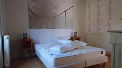 Un ou plusieurs lits dans un hébergement de l'établissement Jolie maison vue sur mer