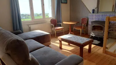 Coin salon dans l'établissement Jolie maison vue sur mer