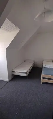 Un ou plusieurs lits dans un hébergement de l'établissement Jolie maison vue sur mer