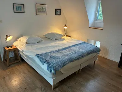 Un ou plusieurs lits dans un hébergement de l'établissement Belle villa en bord de mer à 5 minutes à pied d'une plage de sable fin