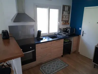 Cuisine ou kitchenette dans l'établissement L'Oasis Ludique