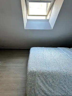 Un ou plusieurs lits dans un hébergement de l'établissement Apartment La Fontaine