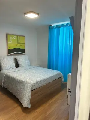 Un ou plusieurs lits dans un hébergement de l'établissement Apartment La Fontaine