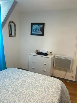 Un ou plusieurs lits dans un hébergement de l'établissement Apartment La Fontaine