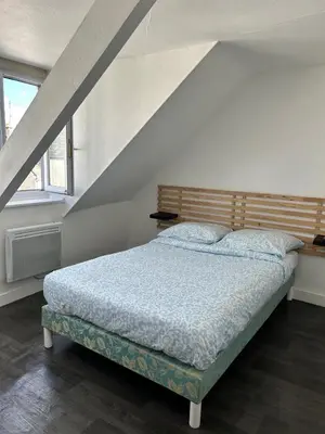 Un ou plusieurs lits dans un hébergement de l'établissement Le Duplex de la Place
