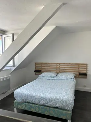 Un ou plusieurs lits dans un hébergement de l'établissement Le Duplex de la Place