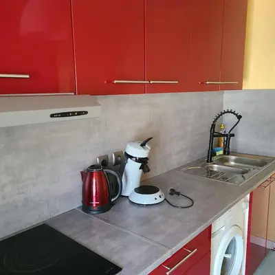 Cuisine ou kitchenette dans l'établissement Appartement Proche du centre