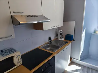 Cuisine ou kitchenette dans l'établissement Studio Cozy Centre
