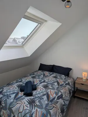 Un ou plusieurs lits dans un hébergement de l'établissement Chaleureux T3 Duplex Centre - 10 min de la gare à pied
